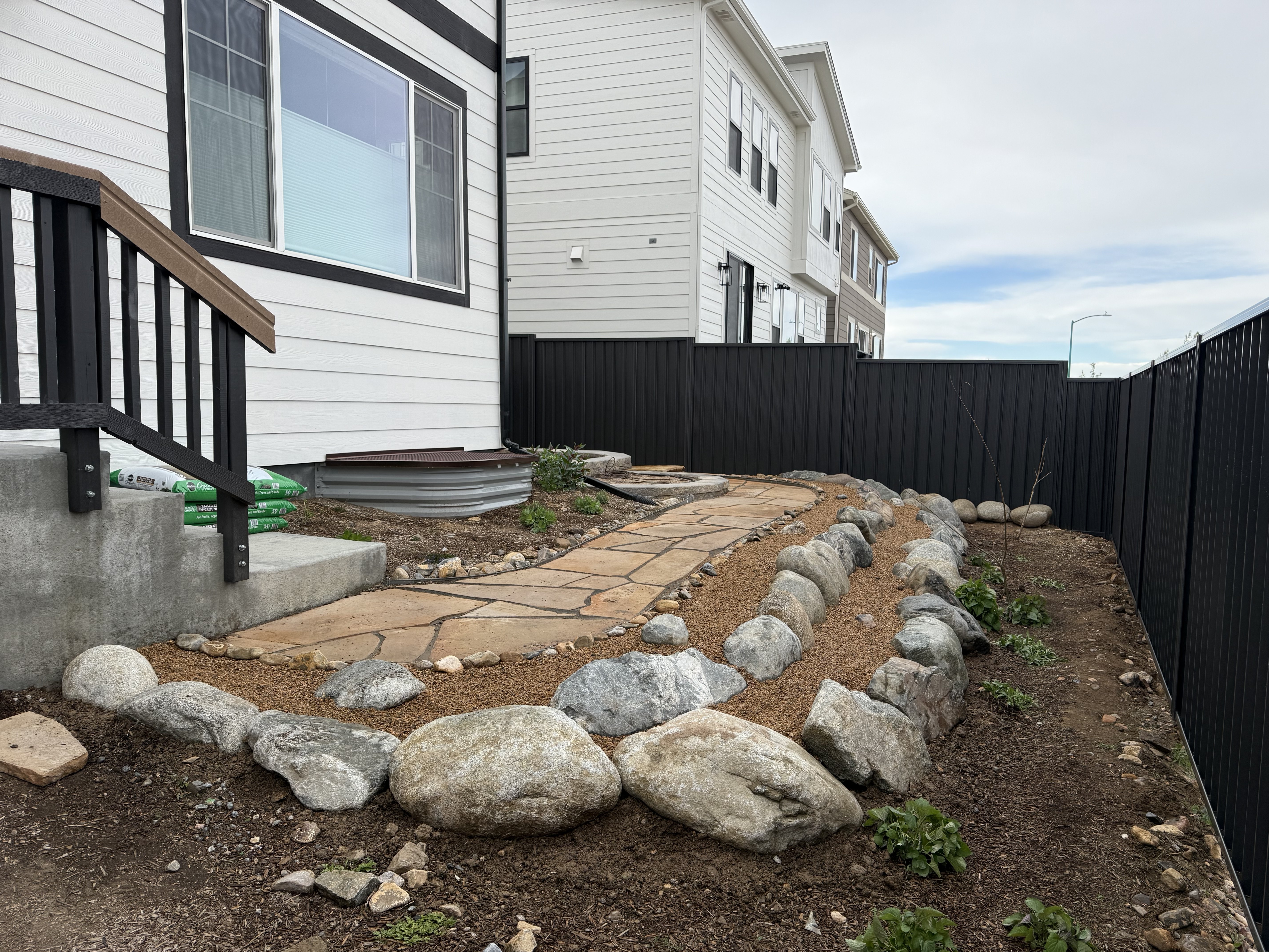 Wildfire mitigation boulder pathway