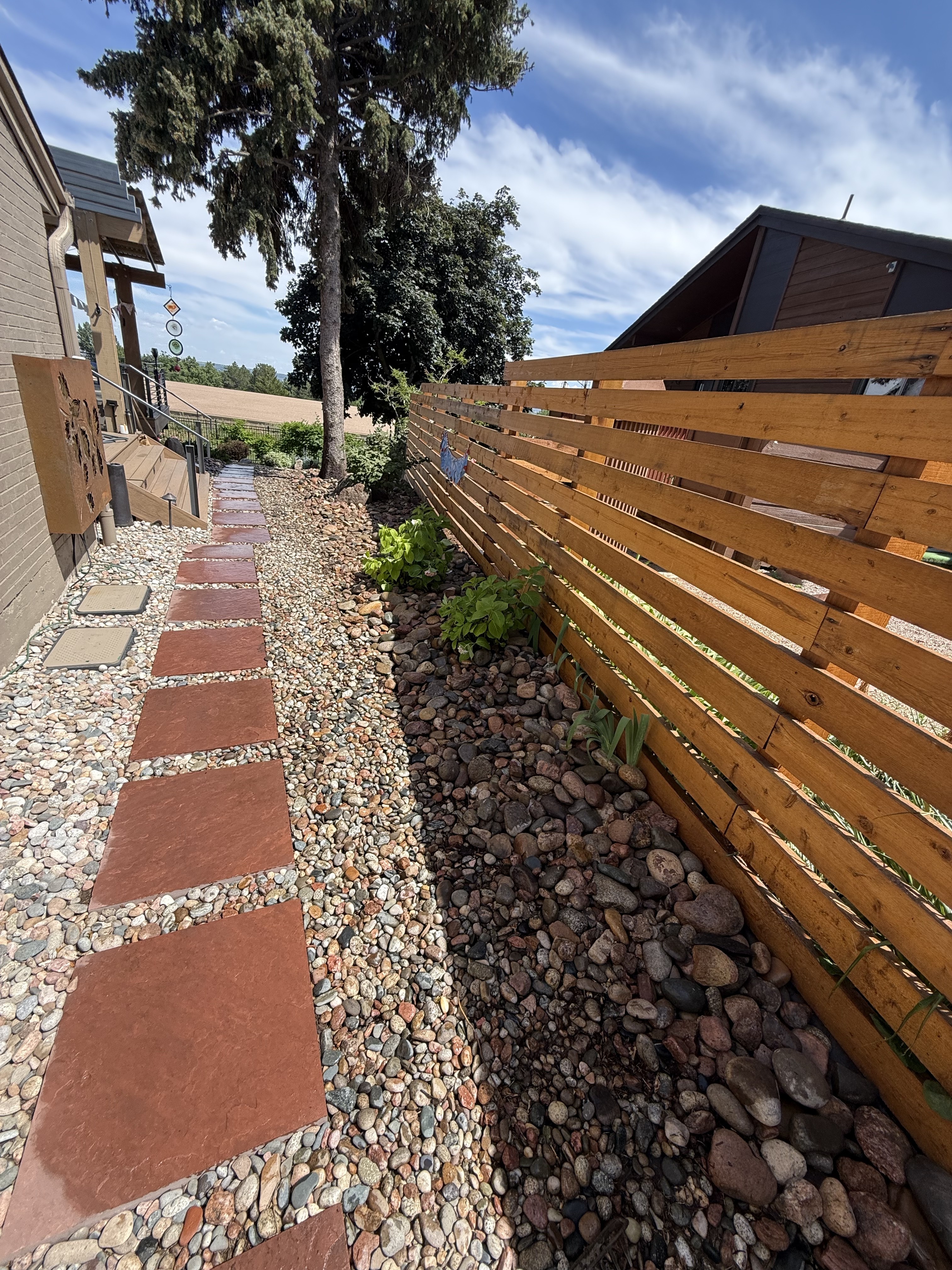 Wildfire mitigation pathway and fence